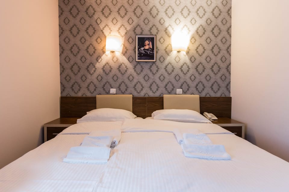 Economy Twin Room | Minibar, desk, iron/ironing board, free WiFi