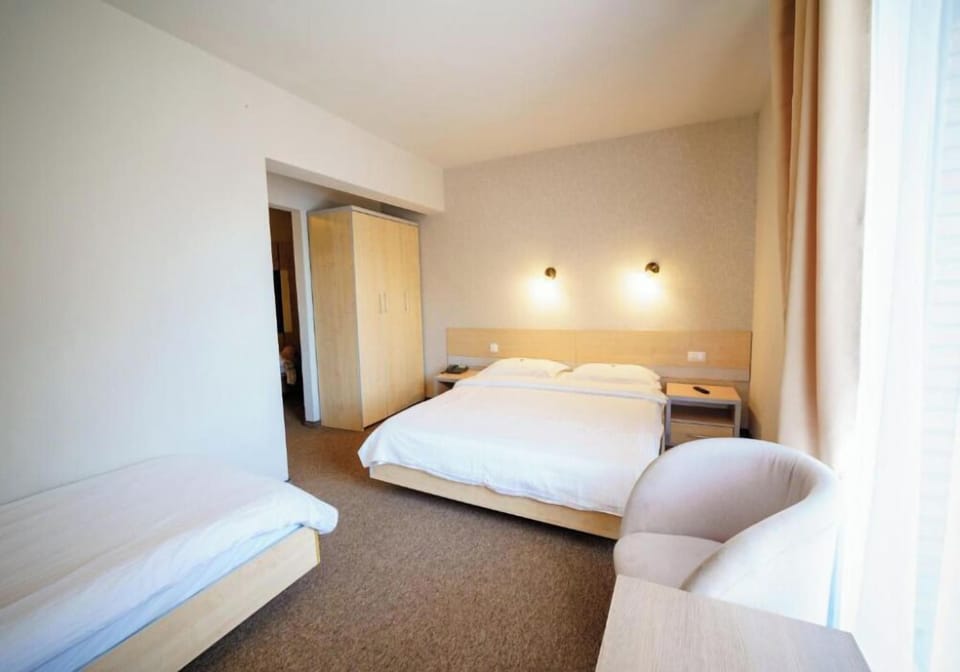 Family Room | Minibar, in-room safe, desk, iron/ironing board