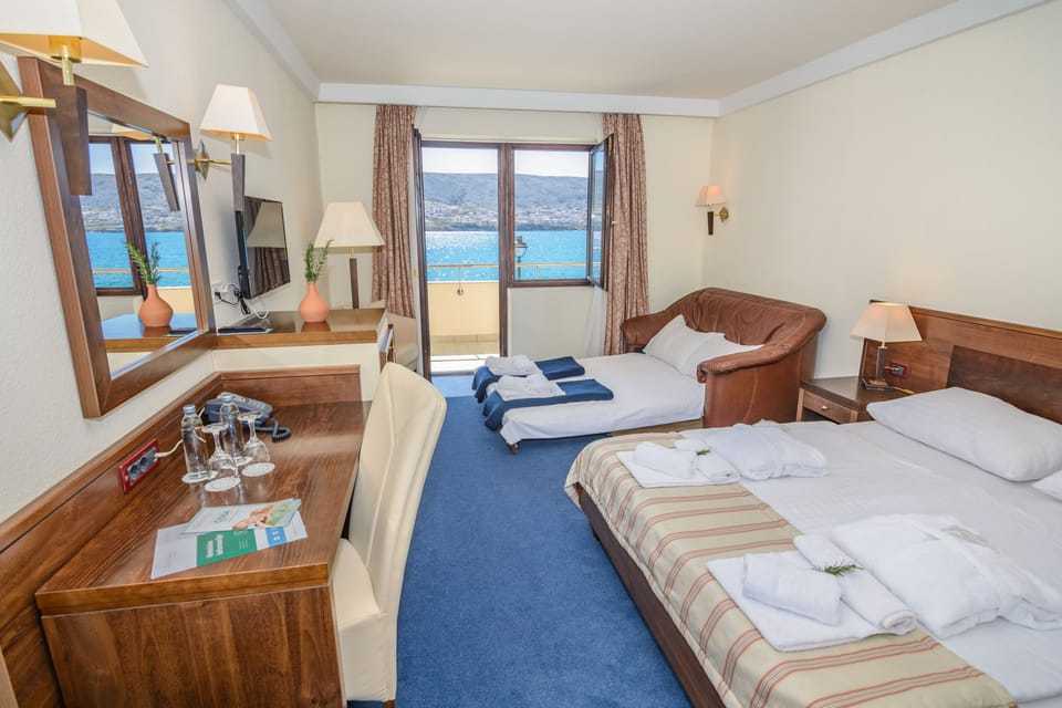 Family Room, Balcony, Sea View | Minibar, in-room safe, desk, laptop workspace