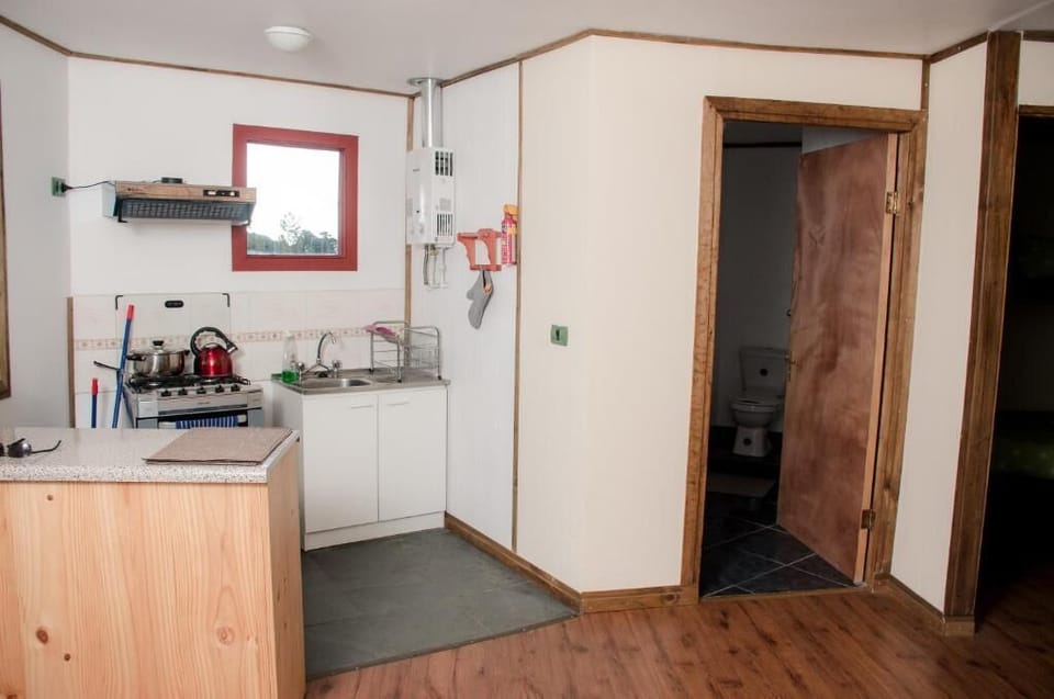 Full-size fridge, microwave, cookware/dishes/utensils, cleaning supplies