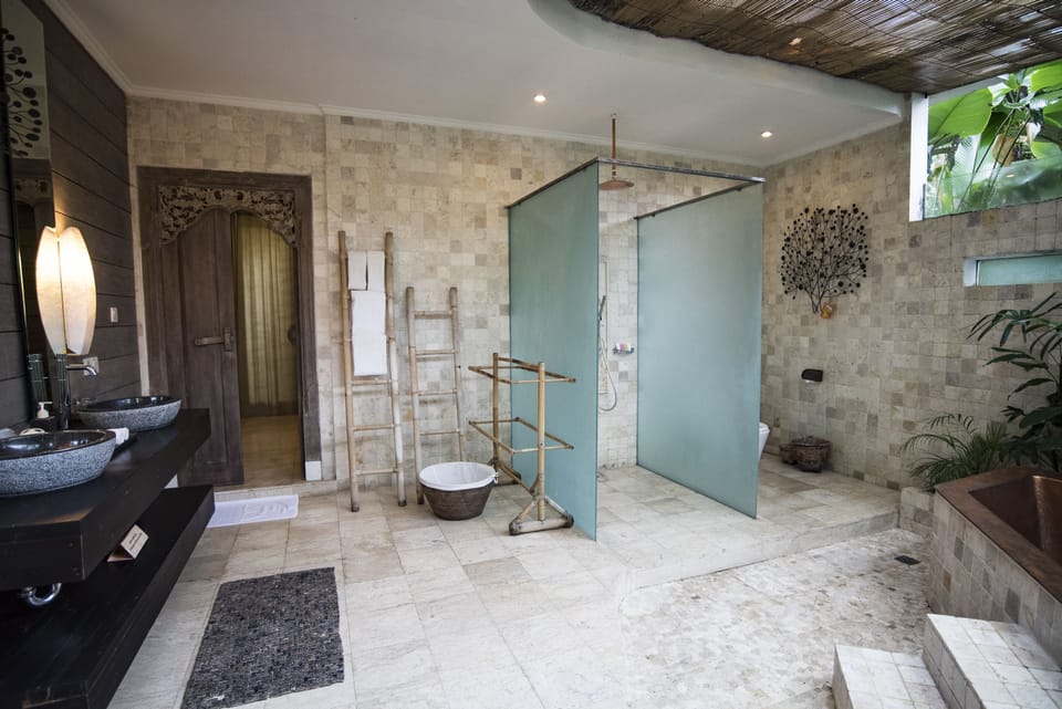 Separate tub and shower, rainfall showerhead, designer toiletries