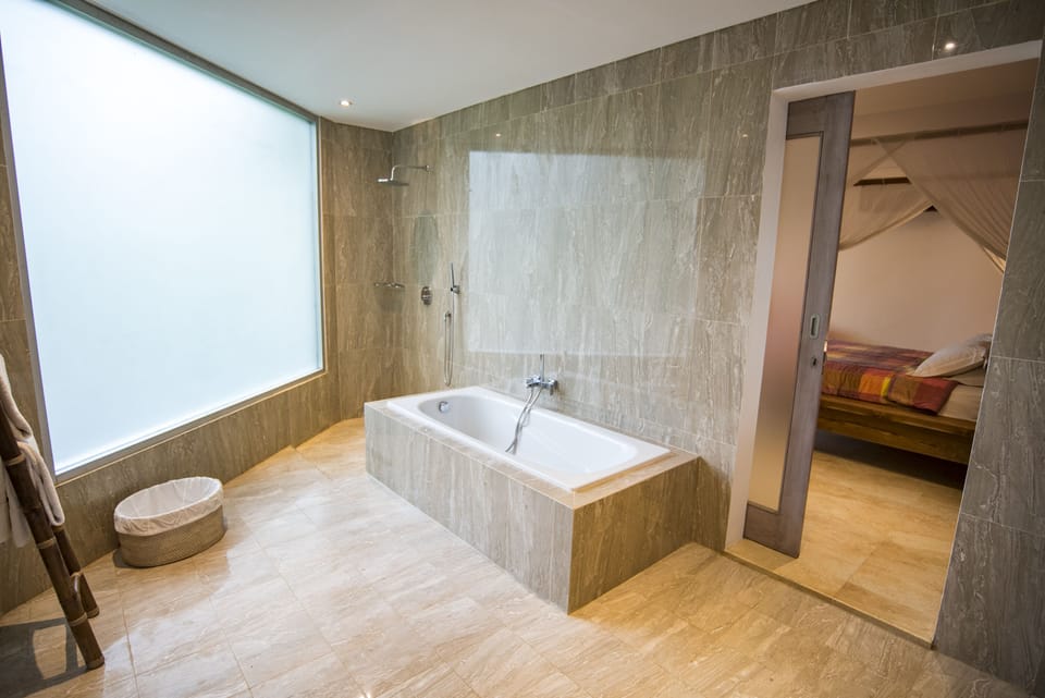 The Nature Suite | Bathroom | Separate tub and shower, rainfall showerhead, designer toiletries