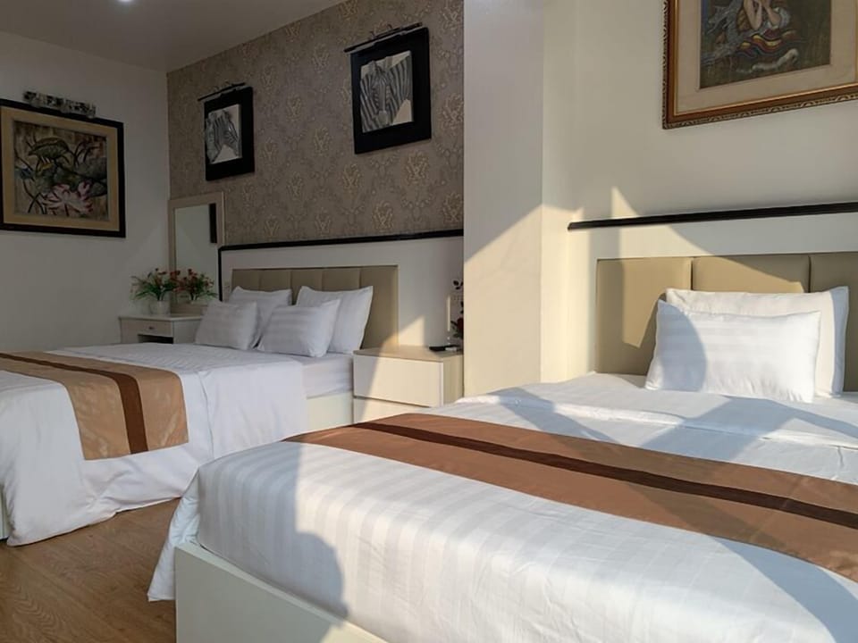Family Room | Minibar, desk, blackout drapes, free WiFi