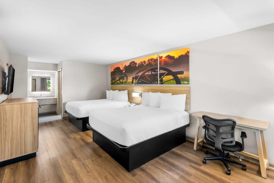 Room, 2 Queen Beds, Non Smoking | In-room safe, desk, rollaway beds, bed sheets