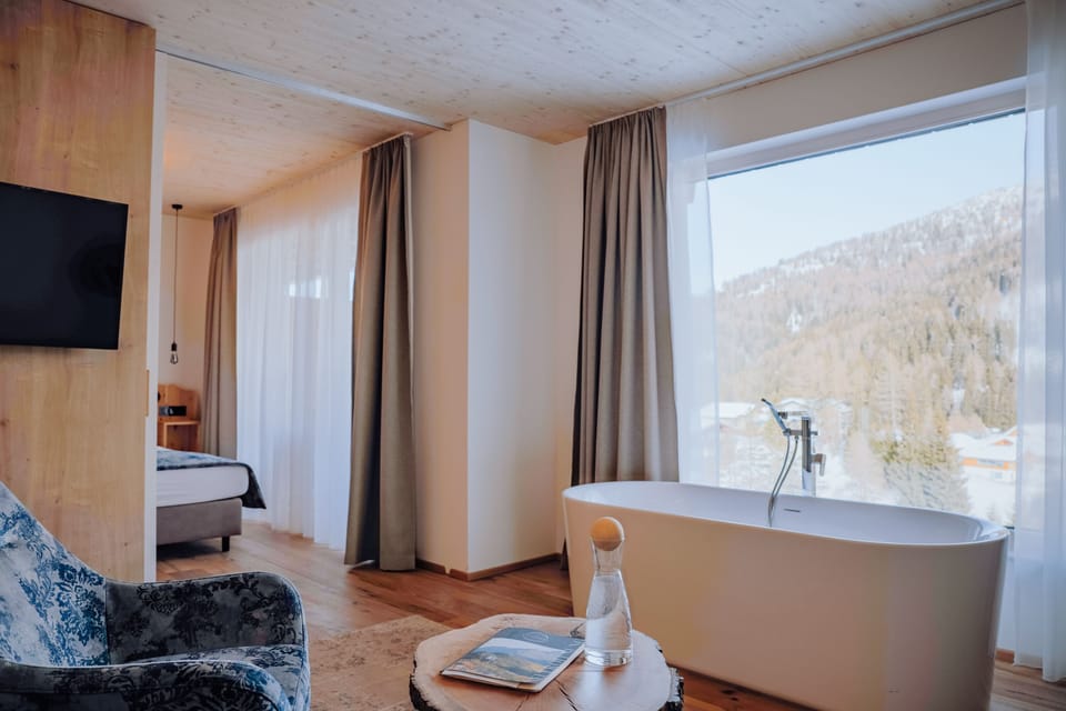 Superior Suite, 1 Queen Bed with Sofa bed, Mountain View | Living area | Flat-screen TV, fireplace
