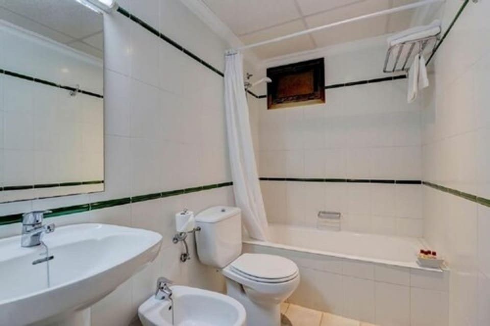 Bathtub, hair dryer, towels, soap