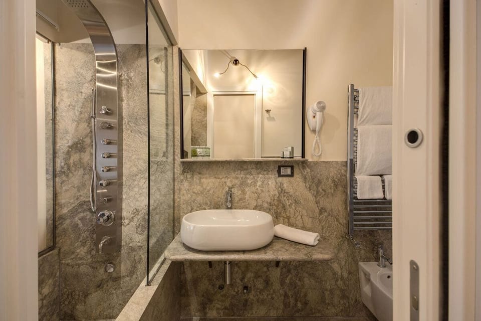 Shower, free toiletries, hair dryer, bidet