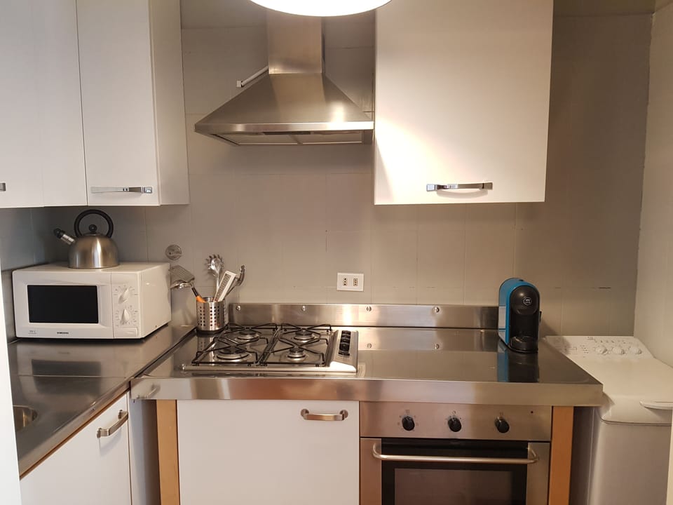 Apartment, 3 Bedrooms | Private kitchen | Full-size fridge, microwave, stovetop, coffee/tea maker