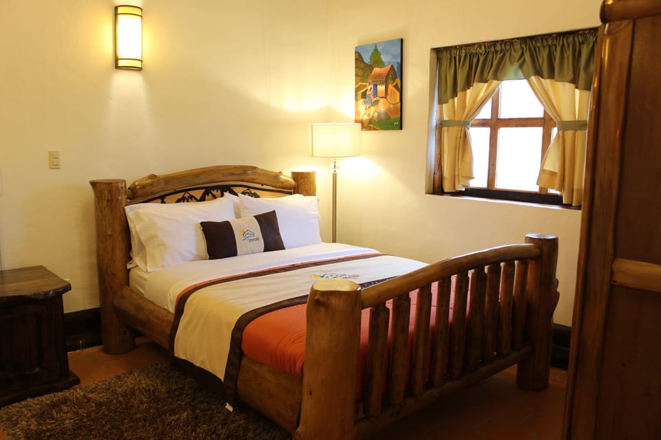 Romantic Cabin, 1 King Bed, Fireplace, Lagoon View | Down comforters, desk, laptop workspace, blackout drapes