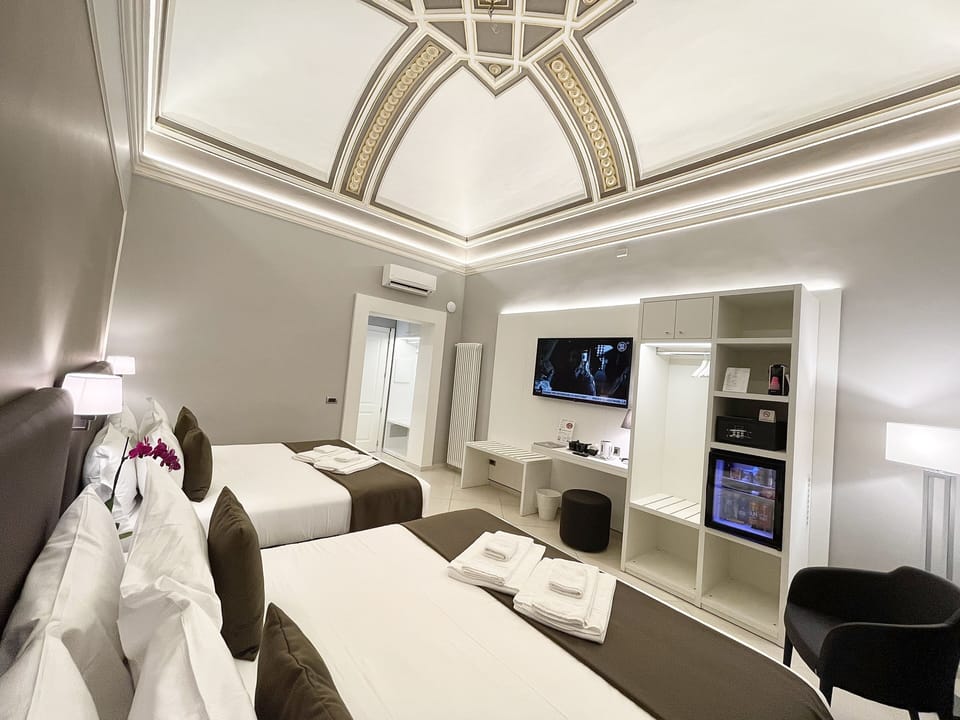 Deluxe Quadruple Room, Multiple Beds, City View | Premium bedding, memory foam beds, minibar, in-room safe