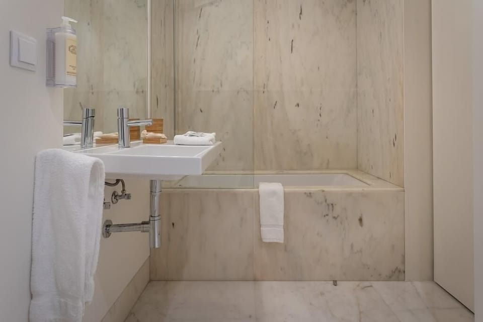 Deluxe Double Room, City View | Bathroom | Shower, hair dryer, towels, soap