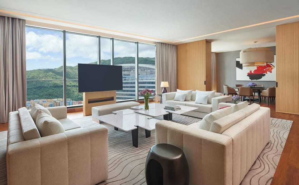 Presidential Suite | Living area | 65-inch LED TV with cable channels, TV