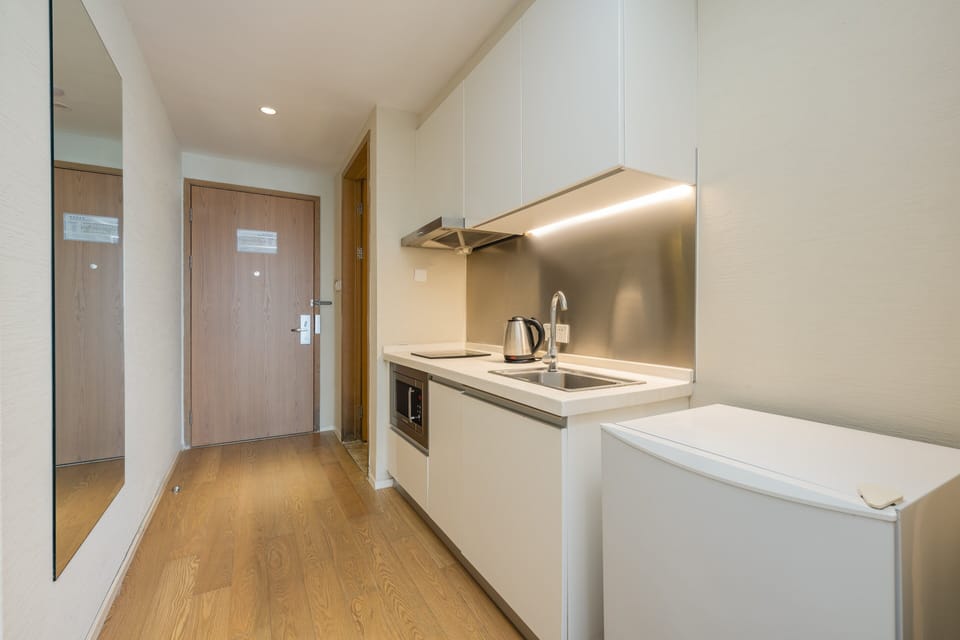 Standard Room, 1 King Bed, Balcony | Minibar, desk, laptop workspace, blackout drapes
