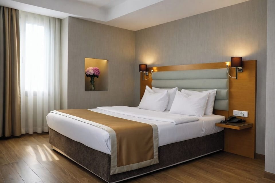 Junior Suite, 1 Bedroom, Partial Sea View | Minibar, in-room safe, desk, laptop workspace