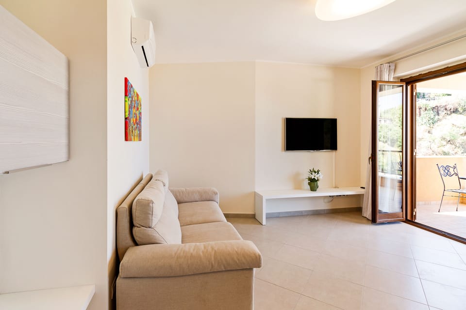 Apartment, 1 Bedroom | Living area | Flat-screen TV