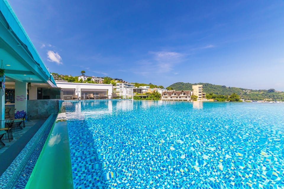 Outdoor pool, open 9:00 AM to 10:00 PM, pool umbrellas, sun loungers