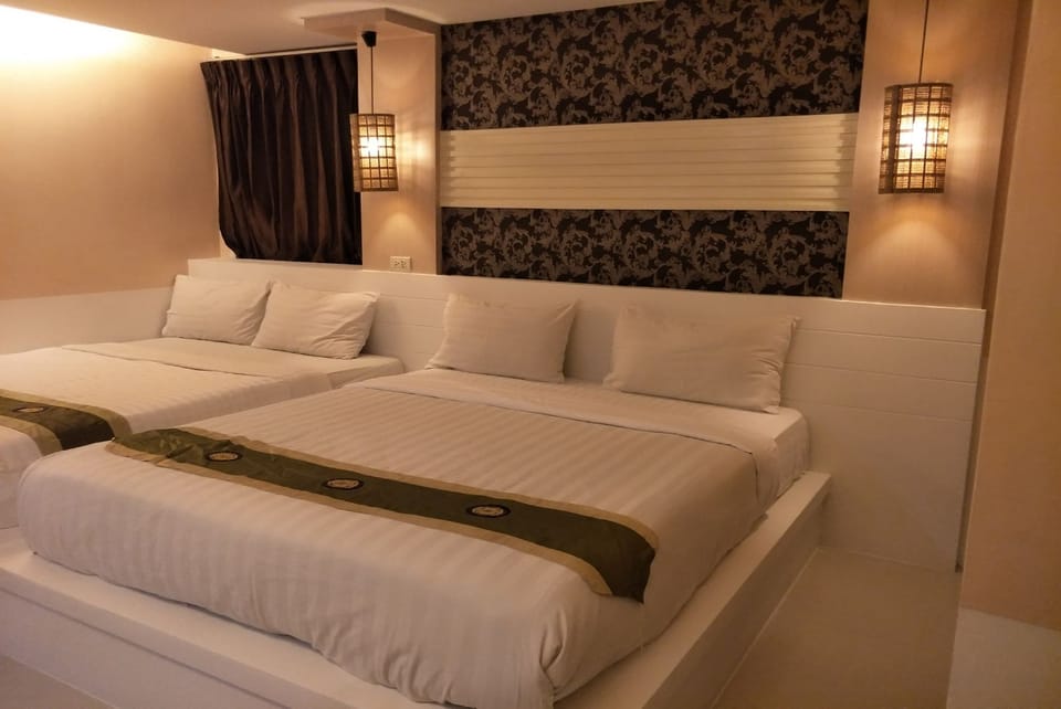 Deluxe Quadruple Room, Multiple Beds | Free WiFi, bed sheets