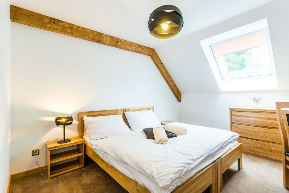 Premium bedding, desk, laptop workspace, blackout drapes