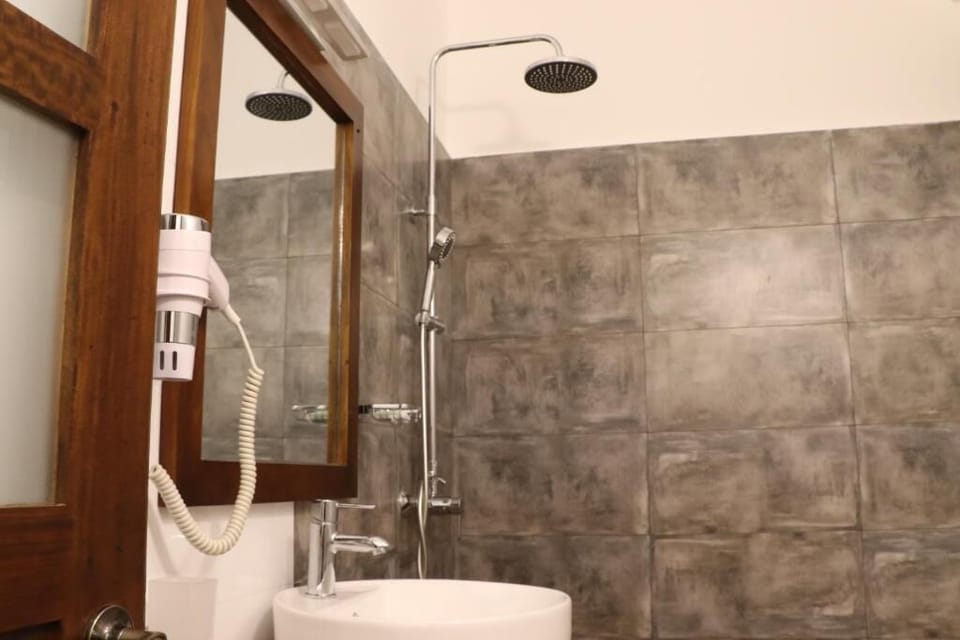 Shower, rainfall showerhead, bidet, towels