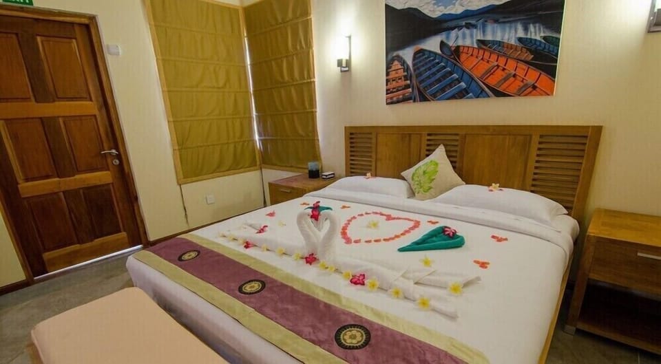 Garden View Room | Blackout drapes, iron/ironing board (on request), cribs (free)