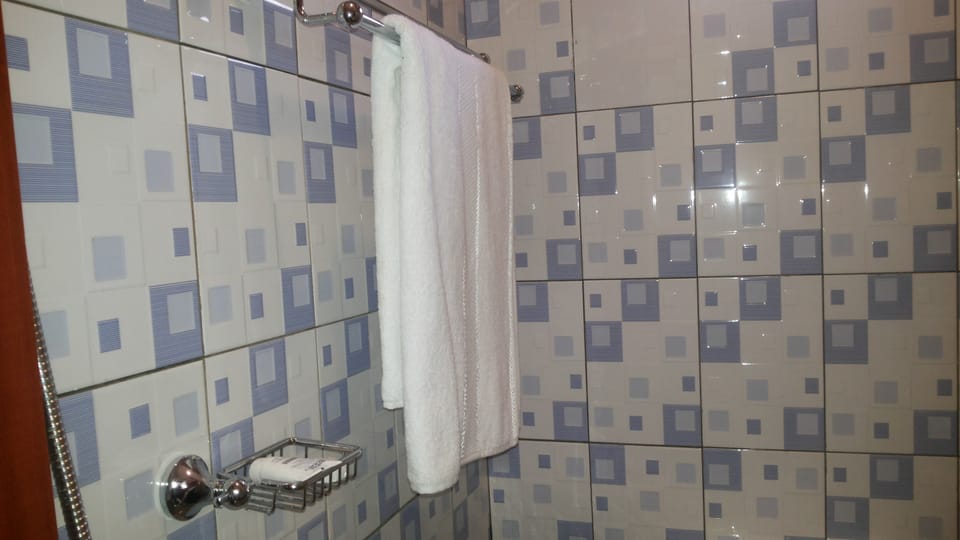 Shower, slippers, towels, soap