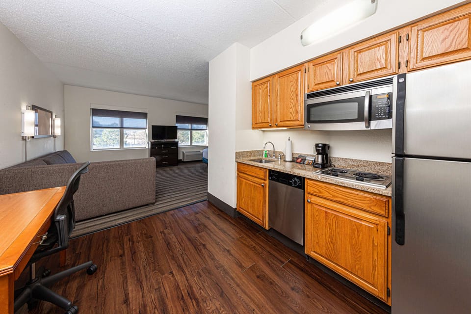 Desk, laptop workspace, blackout drapes, iron/ironing board