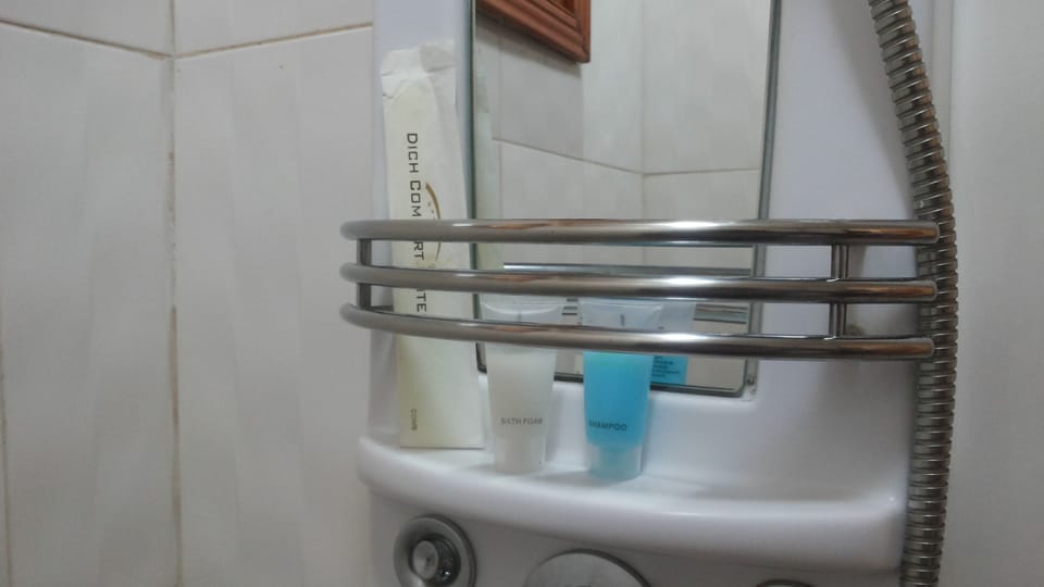 Shower, free toiletries, slippers, towels