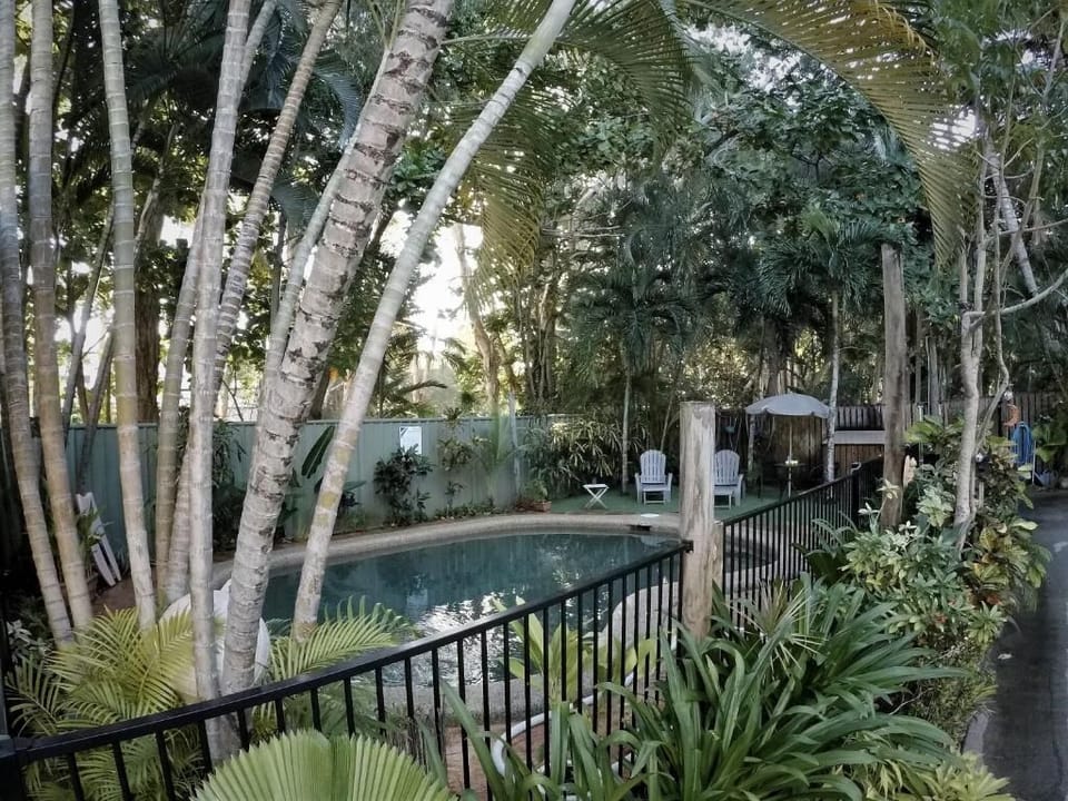 Outdoor pool, open 7:30 AM to 9:30 PM, pool umbrellas