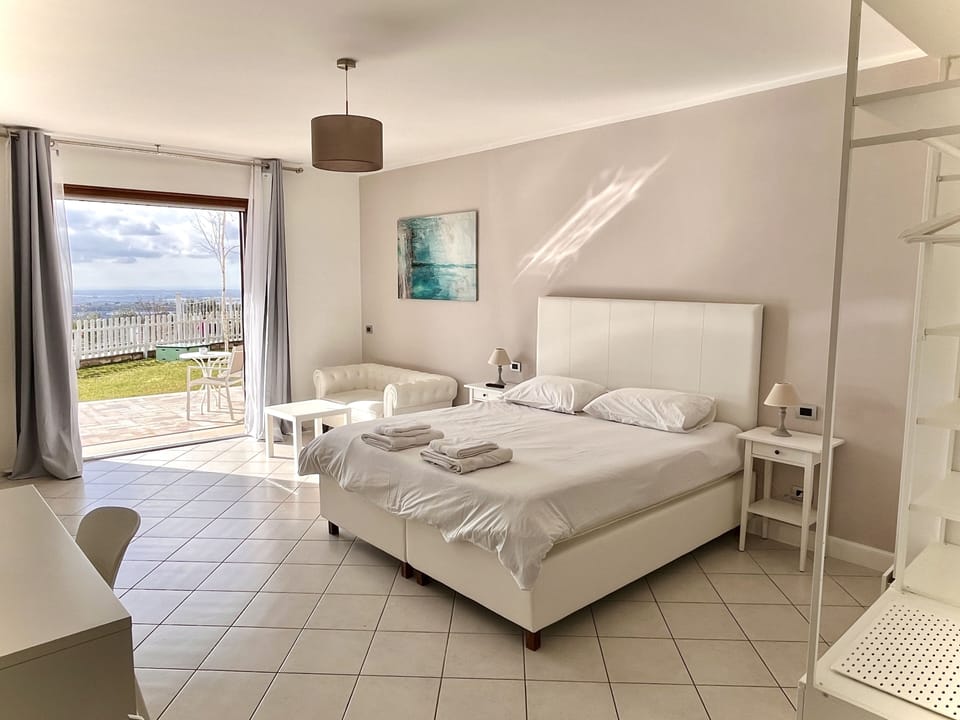 Panoramic Apartment | Hypo-allergenic bedding available, down comforters, memory foam beds
