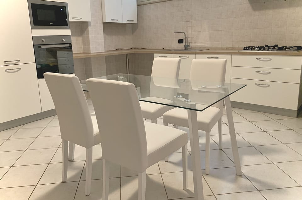 Panoramic Apartment | Private kitchen | Full-size fridge, electric kettle, coffee grinder
