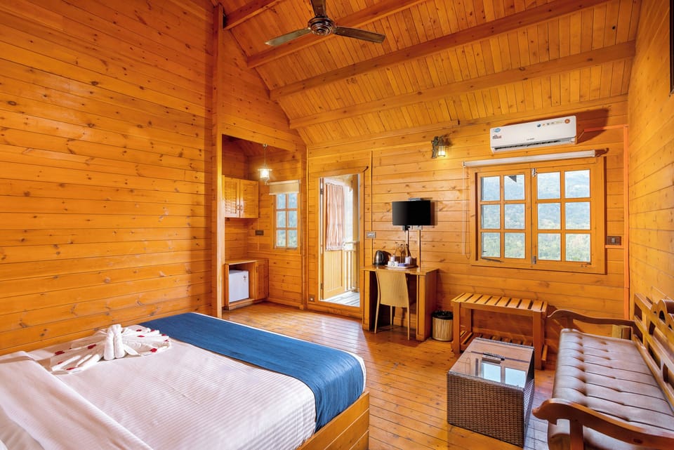 Wooden House AC with Balcony | Living area | 32-inch TV with cable channels