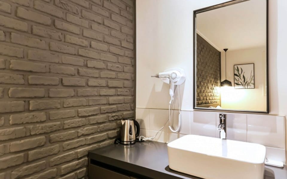 Premium bedding, desk, laptop workspace, blackout drapes