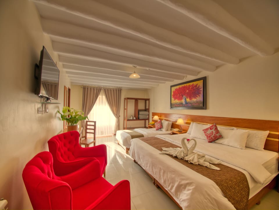 Deluxe Family Room With Balcony and Views | Desk, blackout drapes, WiFi (free), bed sheets