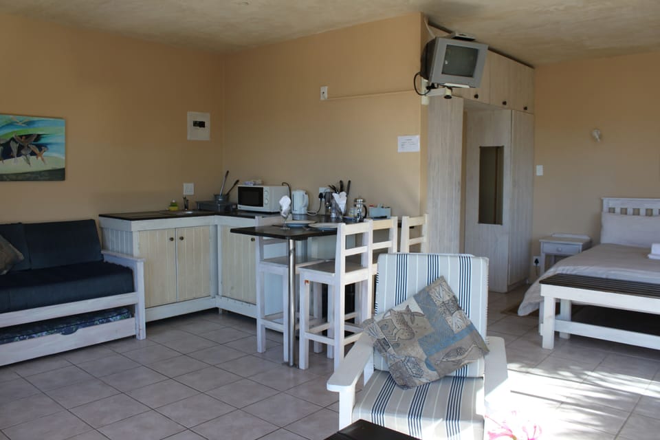 Standard Studio (Self-Catering) | Living area | Flat-screen TV