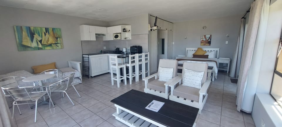 Standard Studio (Self-Catering) | Living area | Flat-screen TV