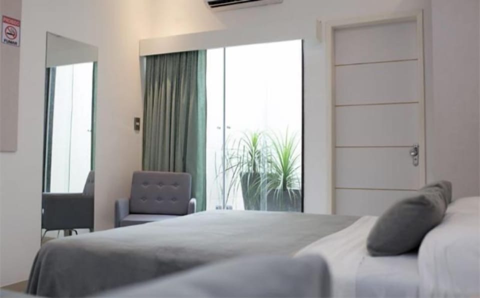 Basic Double or Twin Room | Minibar, in-room safe, blackout drapes, iron/ironing board