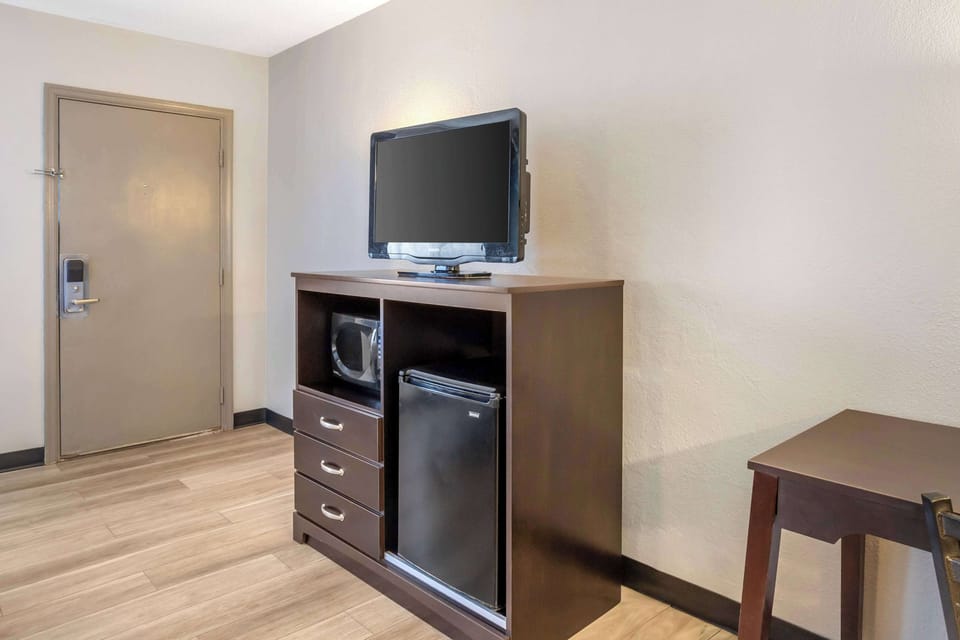 Desk, blackout drapes, iron/ironing board, rollaway beds