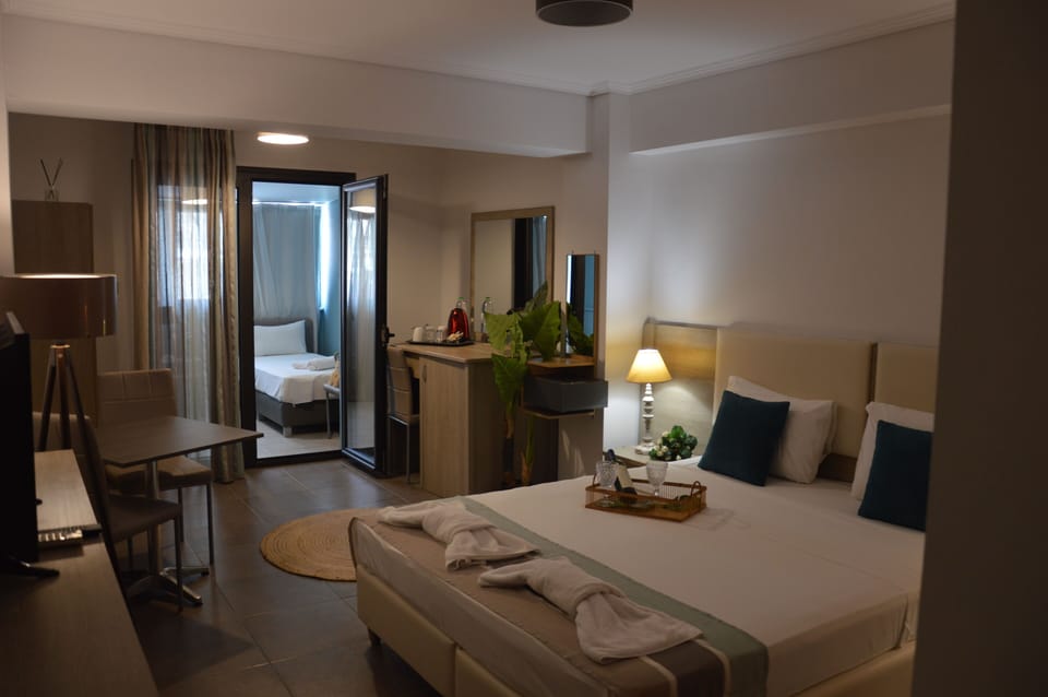 Family Room, City View | Soundproofing, iron/ironing board, free WiFi, bed sheets