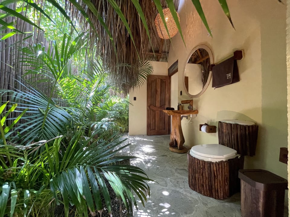 Deluxe Quadruple Room | Bathroom | Shower, rainfall showerhead, towels, soap