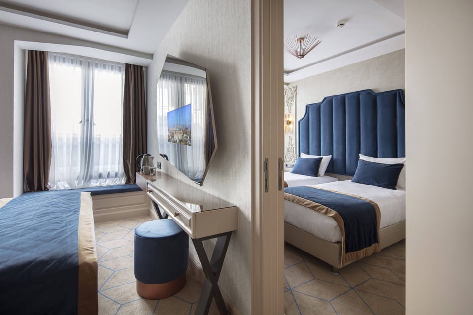Deluxe Quadruple Room | Premium bedding, minibar, in-room safe, desk
