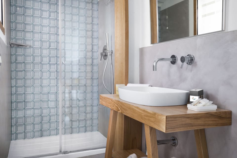 Shower, rainfall showerhead, designer toiletries, hair dryer