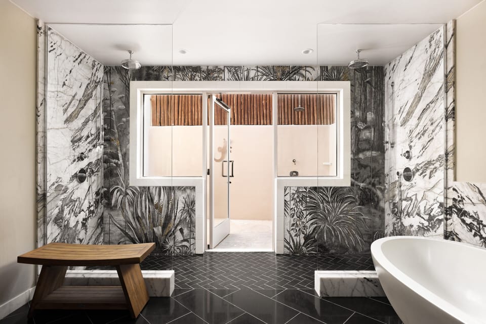 Separate tub and shower, designer toiletries, hair dryer, bathrobes