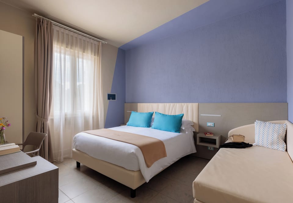 Triple Room | Frette Italian sheets, Select Comfort beds, minibar, in-room safe