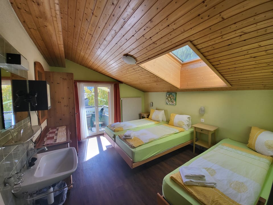 Triple Room, Balcony | Select Comfort beds, in-room safe, individually decorated, desk
