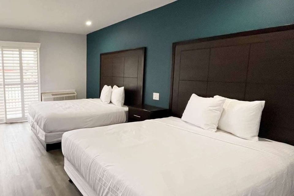 Standard Room, 2 Queen Beds, Non Smoking, Refrigerator & Microwave | Desk, laptop workspace, free WiFi, bed sheets