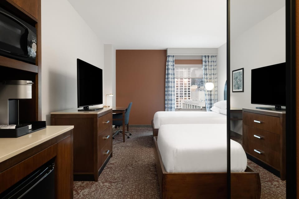 Premium bedding, down comforters, in-room safe, iron/ironing board