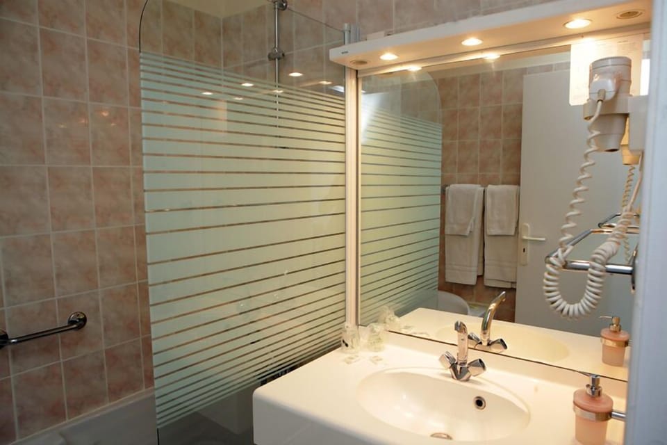 Shower, free toiletries, hair dryer, slippers