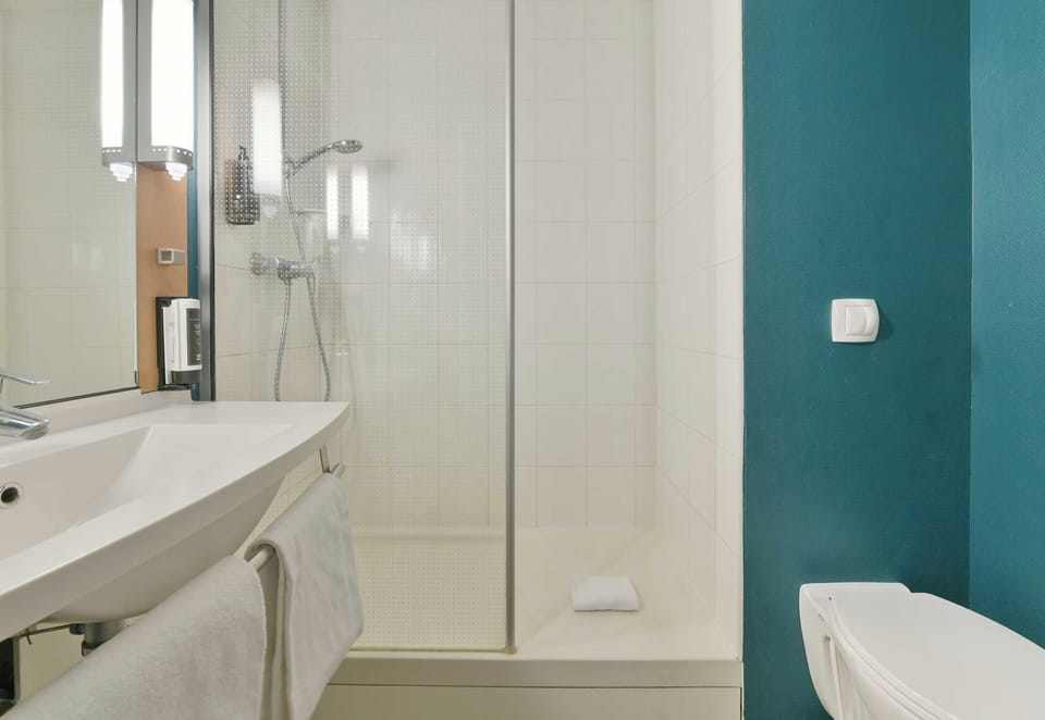 Shower, eco-friendly toiletries, hair dryer, towels