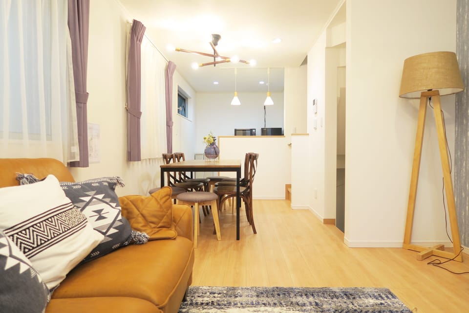 Three-Bedroom Apartment | Living room | 65-inch flat-screen TV with digital channels, TV