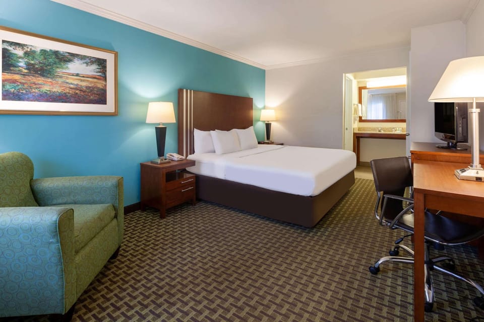 Suite, 1 King Bed, Non Smoking | Premium bedding, desk, iron/ironing board, free cribs/infant beds